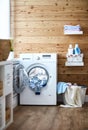 Interior of real laundry room with washing machine at window at Royalty Free Stock Photo