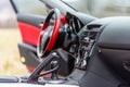 Interior of red sport car Mazda RX-8 in nature.