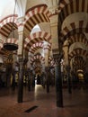 Interior red white striped architecture of Mezquita islamic mosque catholic church Cathedral Cordoba Andalusia Spain Royalty Free Stock Photo