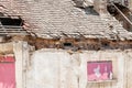 Interior remains of hurricane or earthquake disaster damage on ruined old house in the city with collapsed walls, roof and bricks Royalty Free Stock Photo