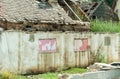 Interior remains of hurricane or earthquake disaster damage on ruined old house in the city with collapsed walls, roof tiles and b Royalty Free Stock Photo