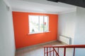 Interior of a residential building in white and orange colors with entrance doors Royalty Free Stock Photo