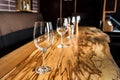 Empty wine glasses on slab table in restaurant Royalty Free Stock Photo