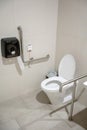 Interior of restroom for elderly people with lavatory toilet bow