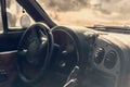 Interior of a retro car with steering wheel and dashboard. Selective focus. Royalty Free Stock Photo