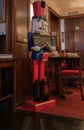 Interior of retro restaurant with antique wooden statue of nutcracker.