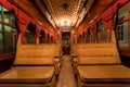 Interior of retro tramway without passengers, old vehicle driving by rail road in capital city