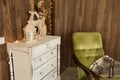 Interior room with chest of drawers and an old chair Royalty Free Stock Photo