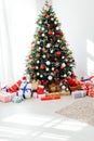 Interior room with Christmas tree window with new year gifts Royalty Free Stock Photo