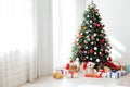 Interior room with Christmas tree window with new year gifts Royalty Free Stock Photo