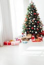 Interior room with Christmas tree window with new year gifts Royalty Free Stock Photo