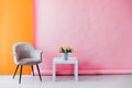 Interior of a pink room with colored chairs, armchairs