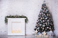 Interior room decorated in Christmas style. No people. Home comfort of modern house. Xmas tree and fireplace Royalty Free Stock Photo