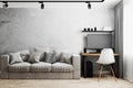 Interior of a room with gray sofa and table with PC and white chair, gray concrete wall, track lights on ceiling, home interior,