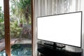 Interior of room, large window white curtain pool view, mock up tv white screen on the table Royalty Free Stock Photo