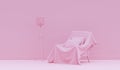 Interior of the room in plain monochrome light pink color with cover sofa and room accessories. Light background with copy space.