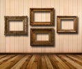 Interior of room with striped wallpaper and gold wooden frames