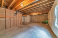 Interior of room under construction with exposed wood frames and plastic on wall Royalty Free Stock Photo