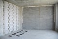 Interior room under construction. Wall without stucco and plasterwork. Royalty Free Stock Photo