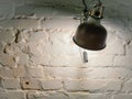 Lighting lamp on a white brick wall