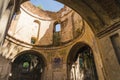 Interior of ruined abandoned church in Lubycza Krolewska. Archways arches and windows. Tower with no roof. Faded frescos