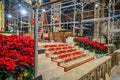 Interior of Saint Patrick`s Cathedral in New York City. Renovation Works in Progress. Christmas Decoration with Red Flowers Royalty Free Stock Photo