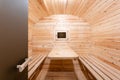 Interior of sauna. rural mobile wooden bath in the form of a barrel in a pine forest