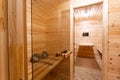 Interior of sauna. rural mobile wooden bath in the form of a barrel in a pine forest