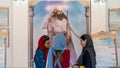 Interior scene from Ateshkadeh Zoroastrian fire temple where 3 Iranian girls are talking, Yazd, Iran