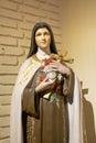 Woman Saint Sculpture Holding Cross