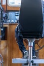 Interior seating of old wooden ferry boat with seating and captains chair