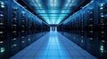 Interior of a server room, where server towers are visible on the left and right sides and a corridor runs through the center. Royalty Free Stock Photo
