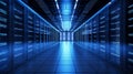Interior of a server room, where server towers are visible on the left and right sides and a corridor runs through the center. Royalty Free Stock Photo