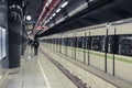 Interior shot of Athens metro station with train and platform. Location, Dimotiko Theatro