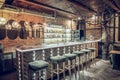 Interior shot of bar being beautified with wooden bar counter Royalty Free Stock Photo