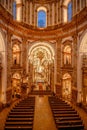 Interior shot of a grand church showcasing ornate pews and stained glass windows: Vienna, Austria