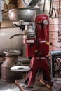 Interior shot of a kitchen featuring an antique red cream separator