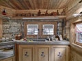 Interior shot of a rustic kitchen in foreground the marble sink Royalty Free Stock Photo