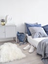 Light bedroom with unmade bed and clothes. Royalty Free Stock Photo