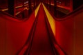 Interior shot of a vibrant red walkway running down the center of the room