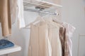 Interior of show room with stylish clothes and accessories.Collection of female clothes hanging on rack in dressing room Royalty Free Stock Photo