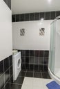 Interior showers with toilets are in black and white