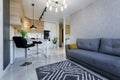 Interior of a small apartment, blue sofa in the kitchen of the living room studio Royalty Free Stock Photo