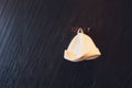 The interior of a small Finnish sauna with wooden walls. On the wall hang hats made of felt for a bath. Royalty Free Stock Photo