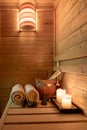 Interior of a small Finnish wooden sauna with sauna accessories Royalty Free Stock Photo