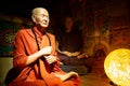 Interior of a souvenir store with monk wax figures in Barcelona, Spain