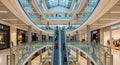 Interior of a Multi- Level Modern Shopping Mall with Escalators and Shops architecture multi-level Royalty Free Stock Photo