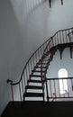 Interior Spiral Staircase and arched window inside Piedras Blancas Lighthouse on the Central California Coast Royalty Free Stock Photo