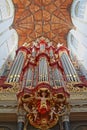 The interior of St Bavokerk Church, with a wooden vaulted ceiling and the organ