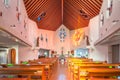 Interior of St Filippo Nishizaka Church in Nagasaki with a wooden ceiling and stained glass windows. Royalty Free Stock Photo